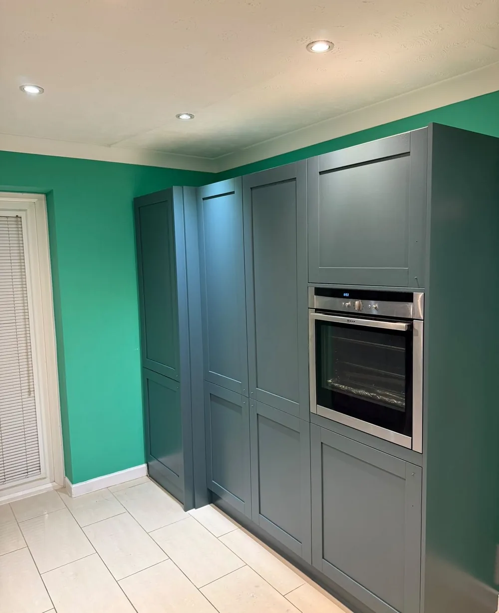 Kitchen tall units and oven housing resprayed in dark grey